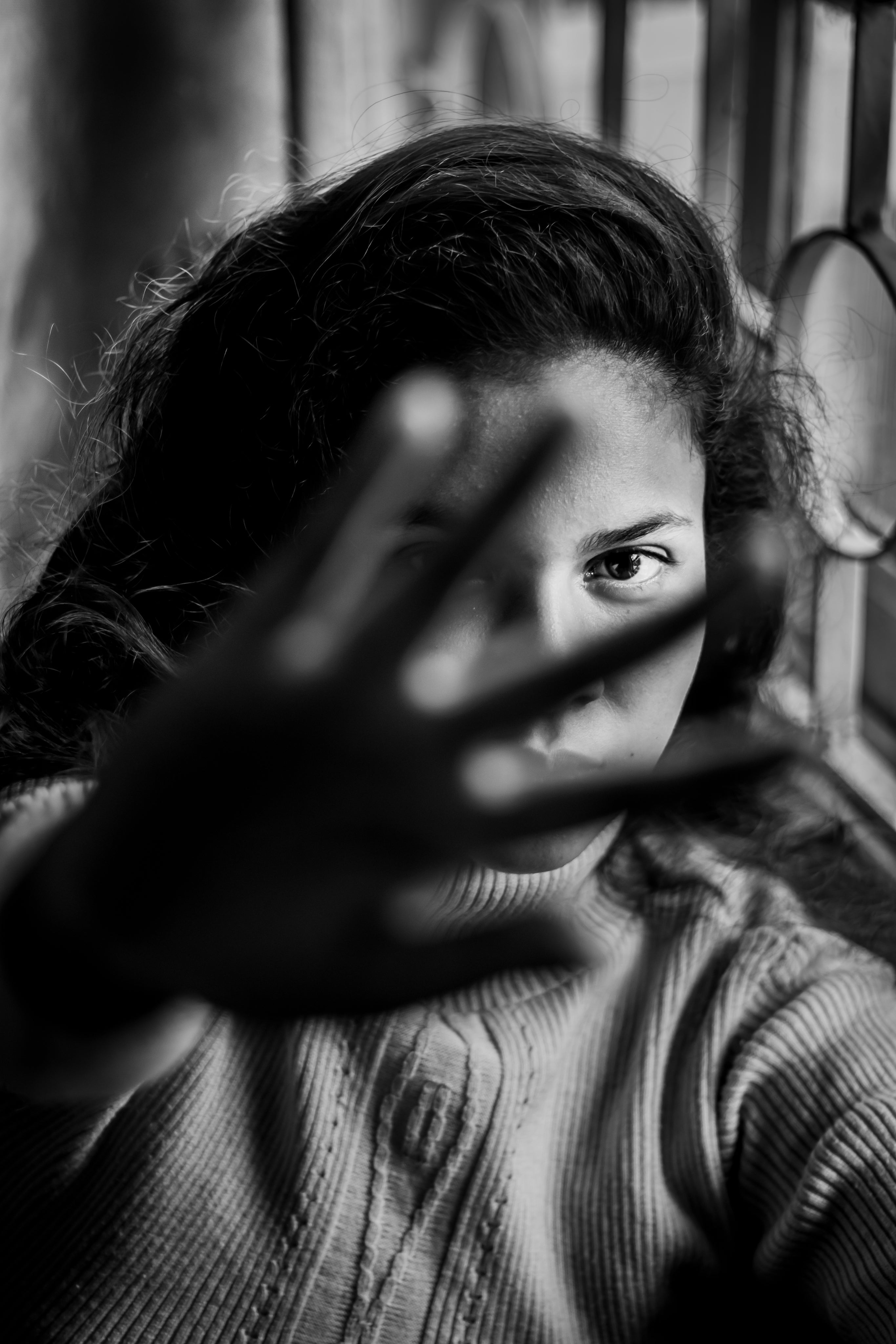 monochrome-portrait-of-woman-holding-her-hand-out - The Velvet Finch